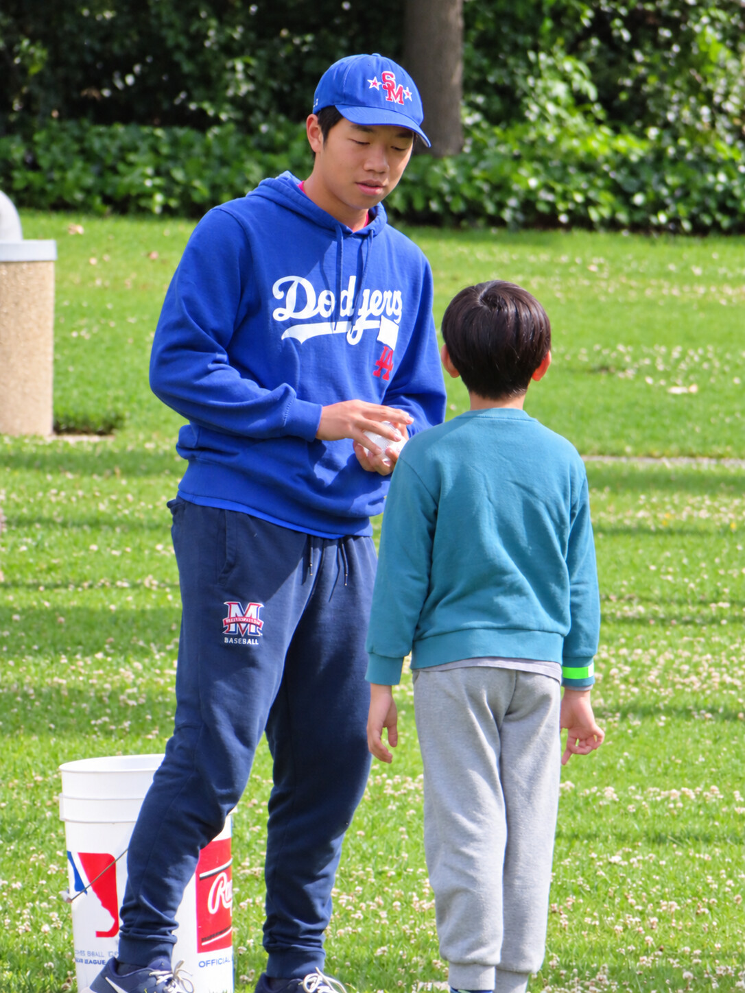 Vincent coaching a young player on the field